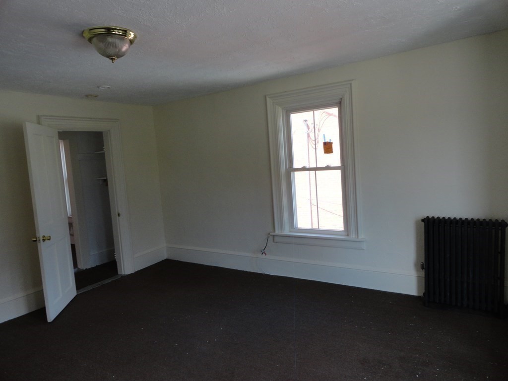 258 Main Street Townsend, MA 01469 - Photo 16 of 23 an empty room with a window