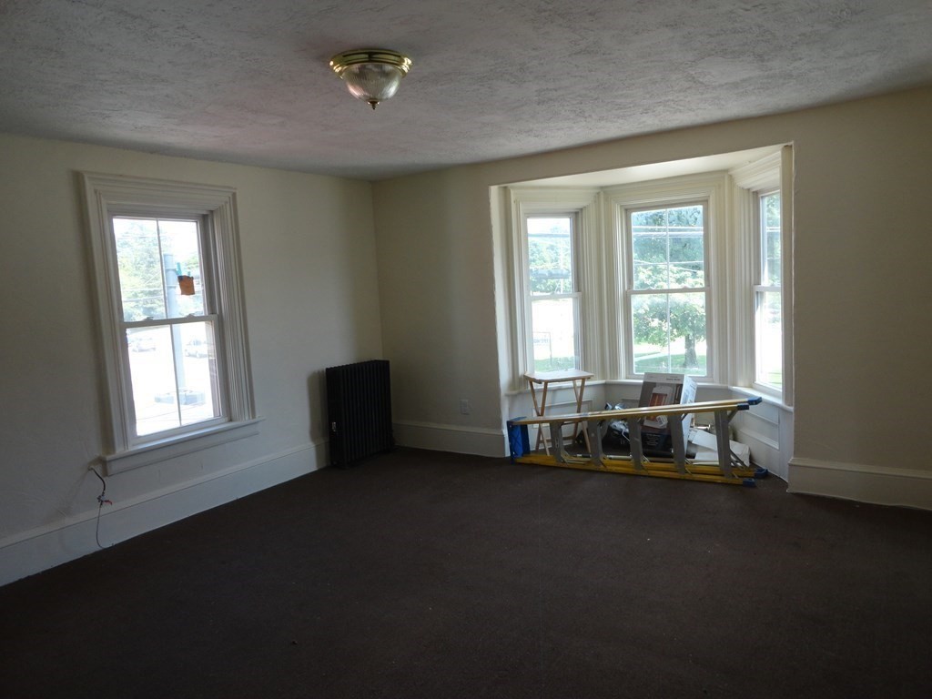 258 Main Street Townsend, MA 01469 - Photo 17 of 23 a living room with furniture and a window