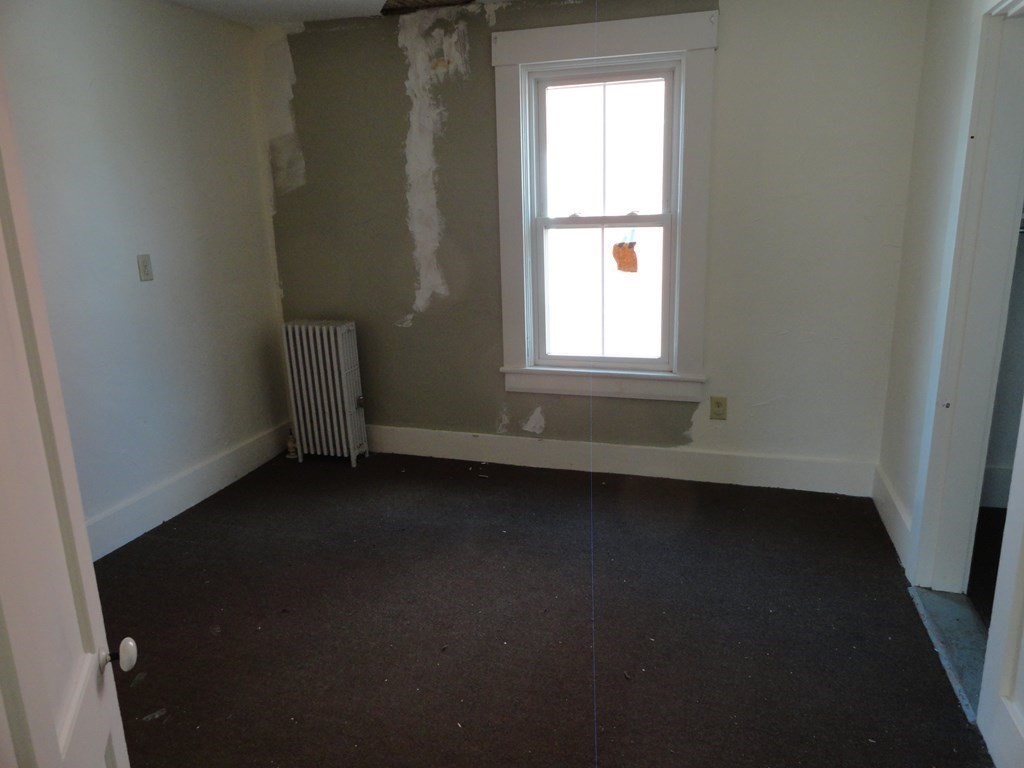 258 Main Street Townsend, MA 01469 - Photo 19 of 23 an empty room with a window