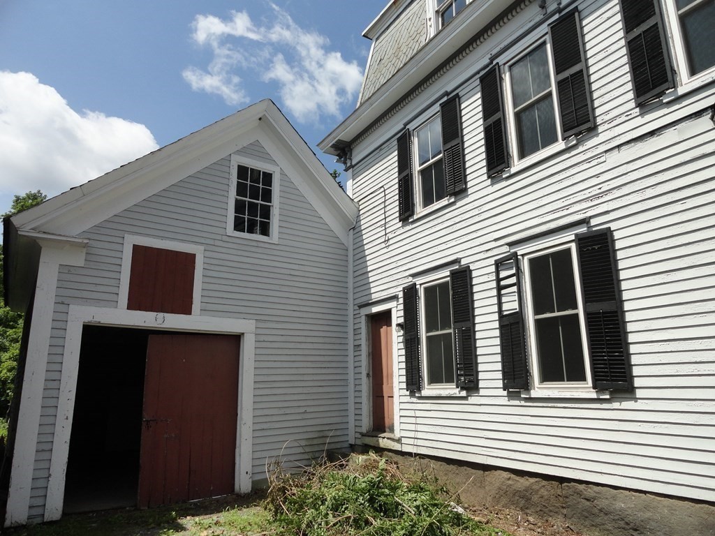 258 Main Street Townsend, MA 01469 - Photo 2 of 23 a view of a house with more windows and brick walls