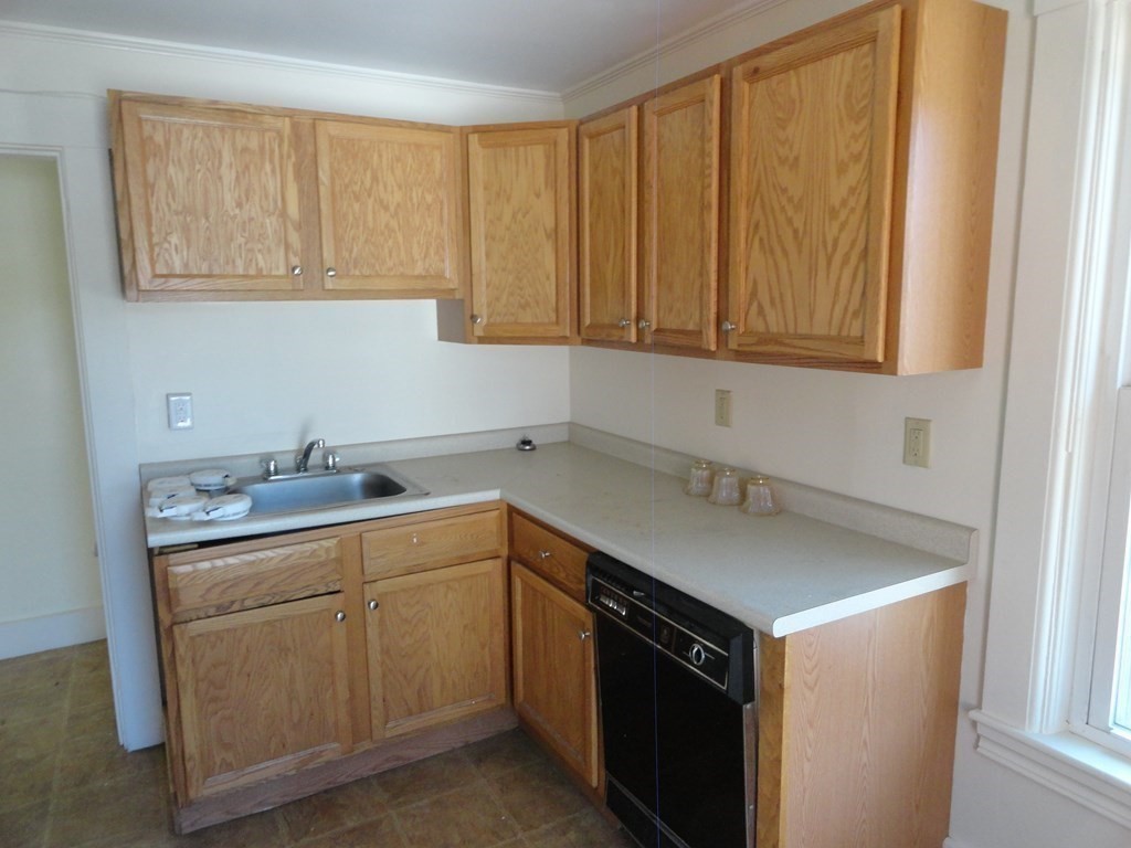 258 Main Street Townsend, MA 01469 - Photo 23 of 23 a kitchen with a sink cabinets and window