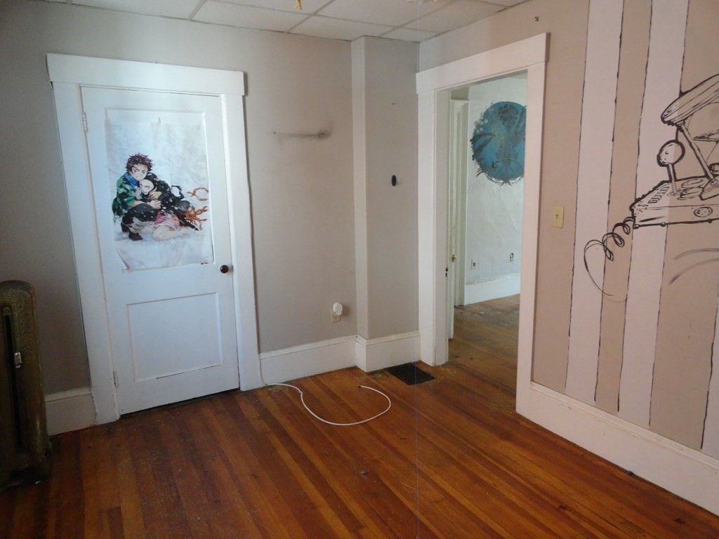 258 Main Street Townsend, MA 01469 - Photo 9 of 23 a view of a hallway with wooden floor and closet