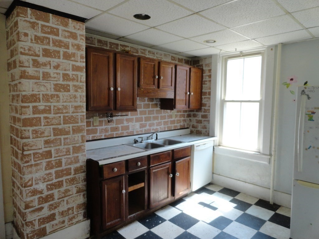 258 Main Street Townsend, MA 01469 - Photo 10 of 23 a bathroom with a granite countertop sink a toilet a mirror and shower