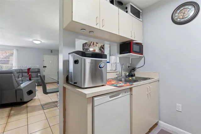 a view of a kitchen with appliances