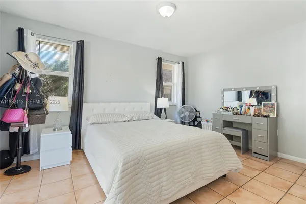 a bedroom with a bed and a cabinets
