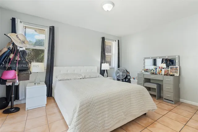 a bedroom with a bed and a cabinets