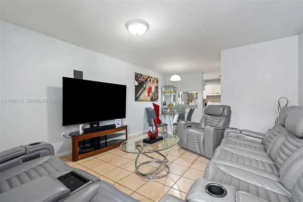 a living room with furniture and a flat screen tv