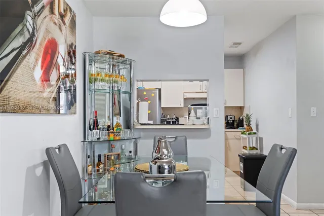 a dining room with furniture and window