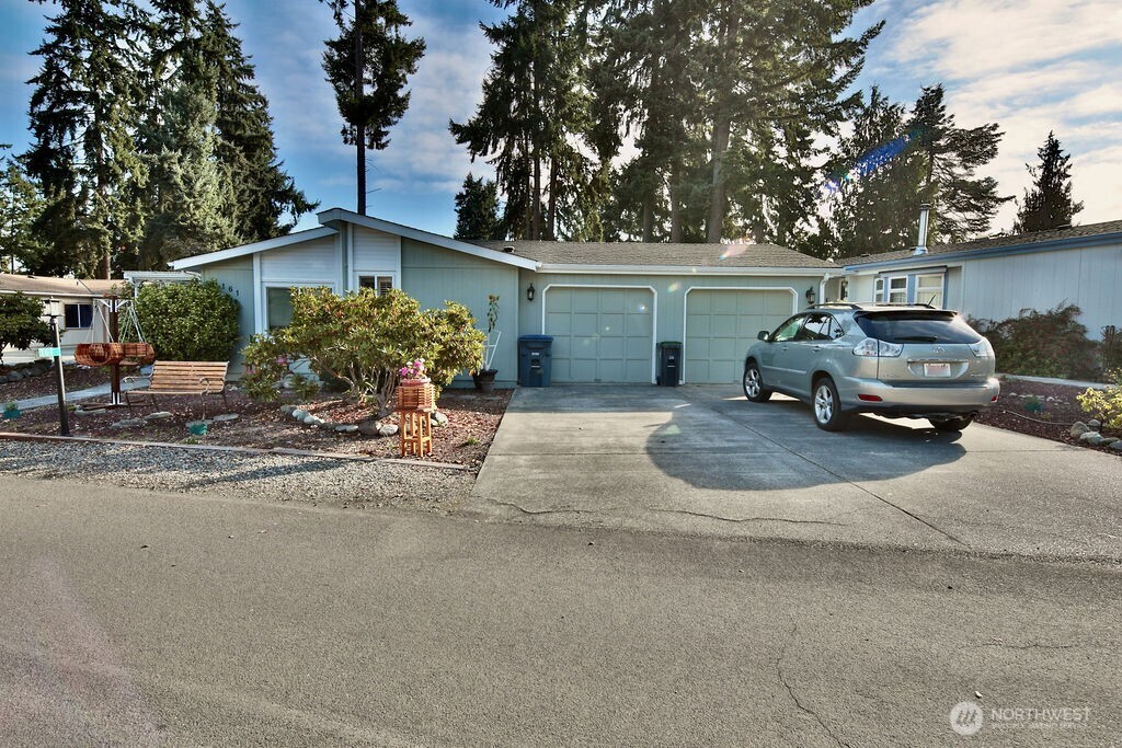 161 Fircrest Drive Sequim, WA 98382 - Photo 2 of 33 a car parked in front of a house