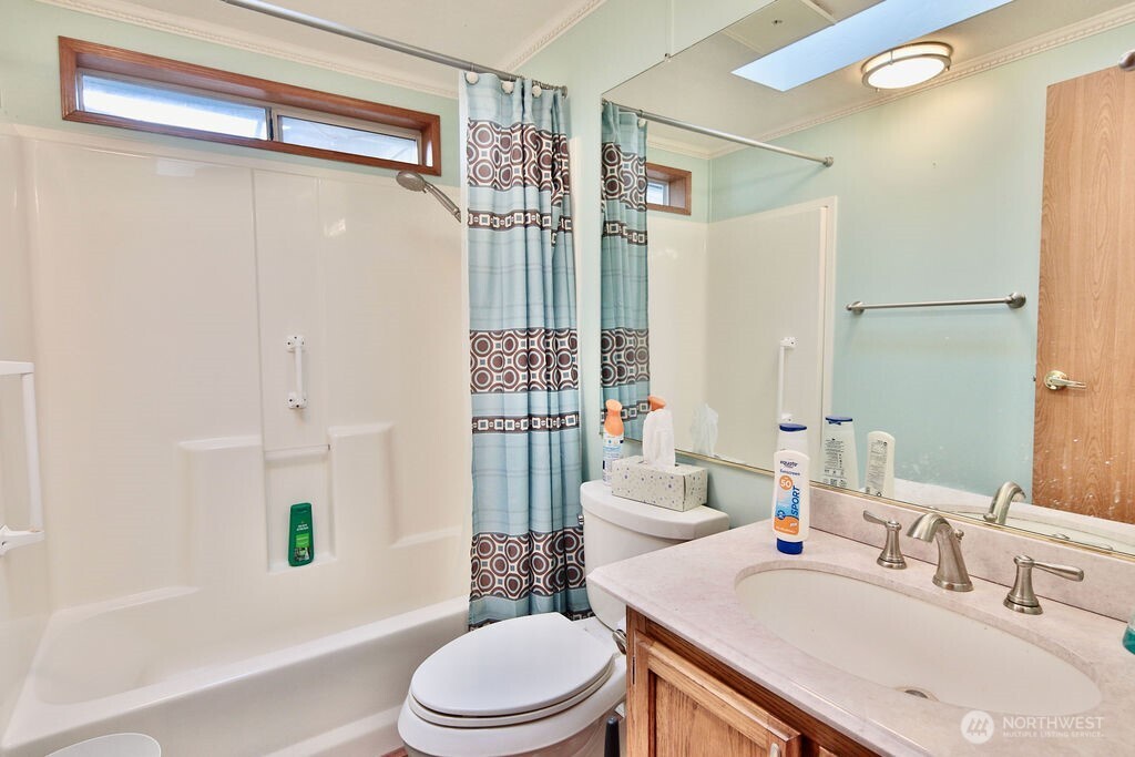 161 Fircrest Drive Sequim, WA 98382 - Photo 21 of 33 a bathroom with a sink toilet and shower