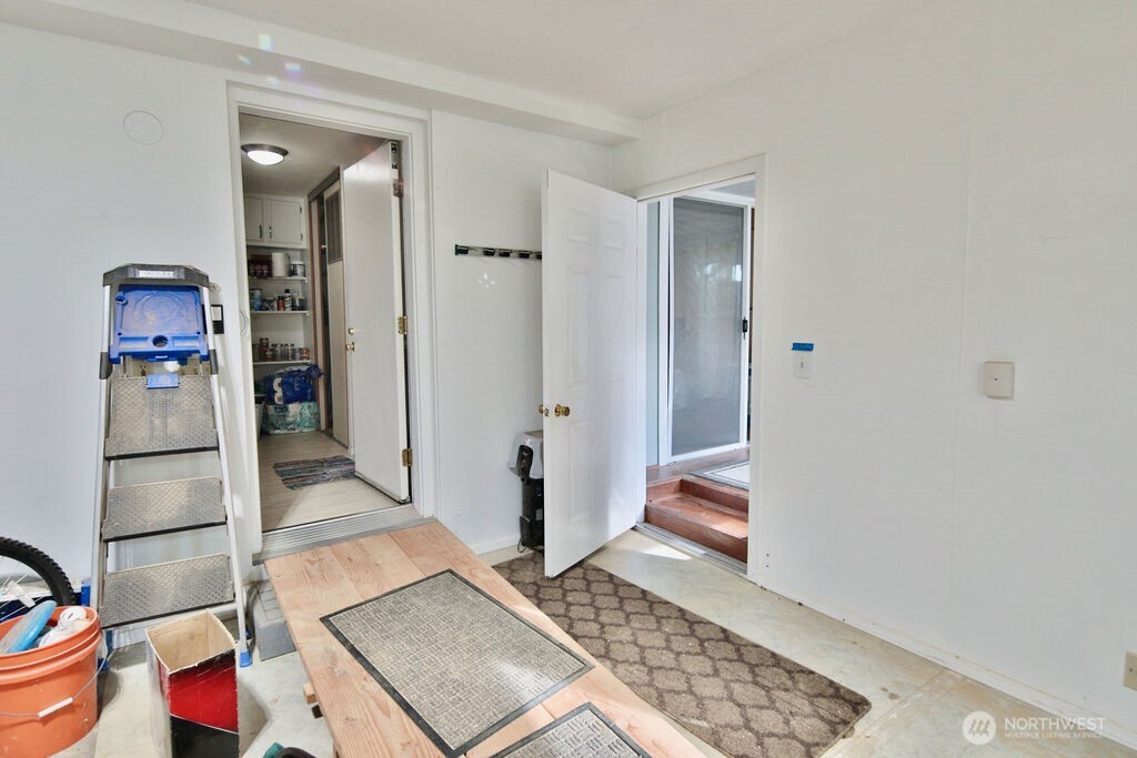 161 Fircrest Drive Sequim, WA 98382 - Photo 26 of 33 a area with wooden floor and cabinets