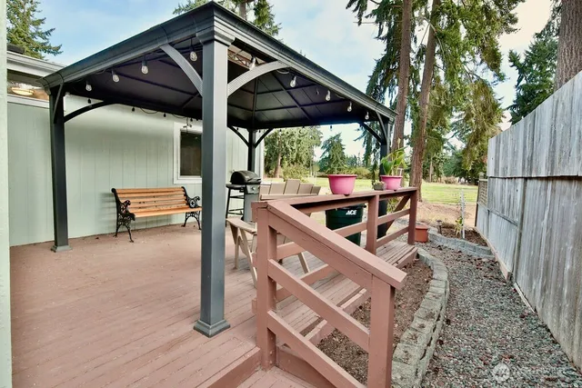 a view of a chairs and table in the patio