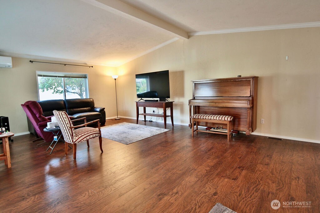 161 Fircrest Drive Sequim, WA 98382 - Photo 3 of 33 a living room with furniture and a flat screen tv with wooden floor