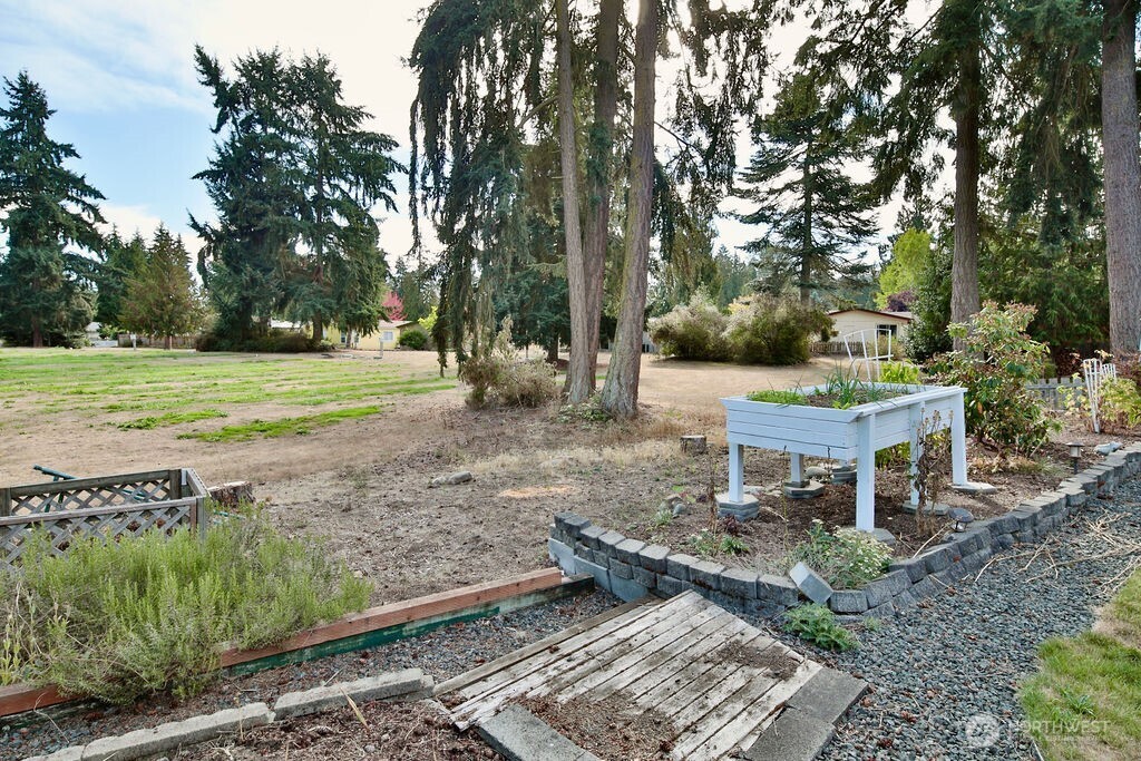 161 Fircrest Drive Sequim, WA 98382 - Photo 32 of 33 a view of a house with a yard and sitting area