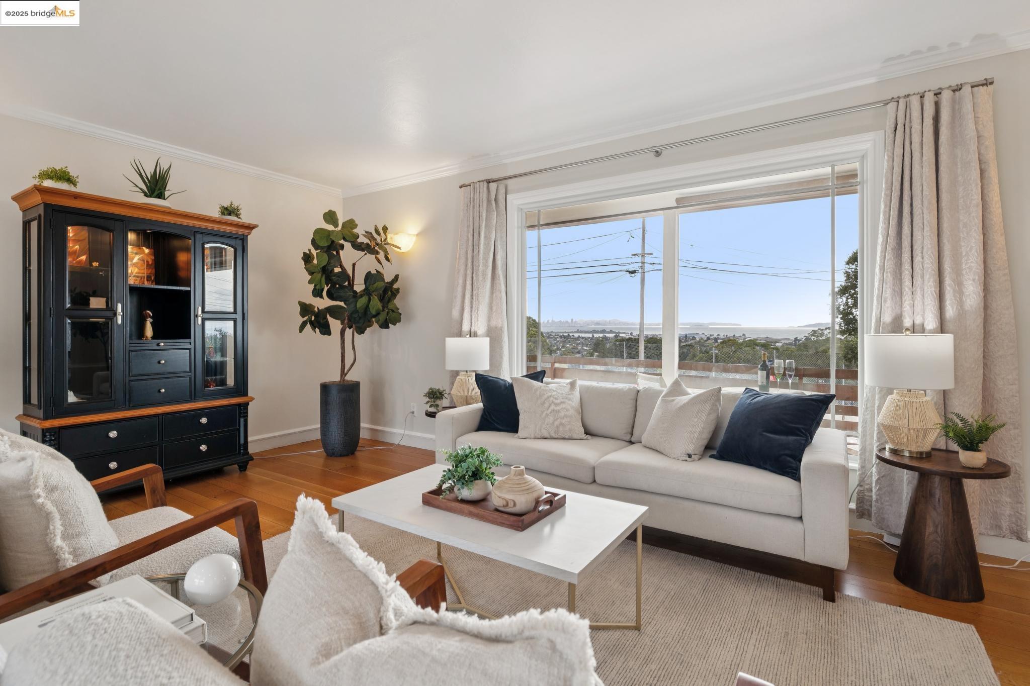 1034 Navellier Street El Cerrito, CA 94530 - Photo 11 of 57 a living room with furniture and a large window