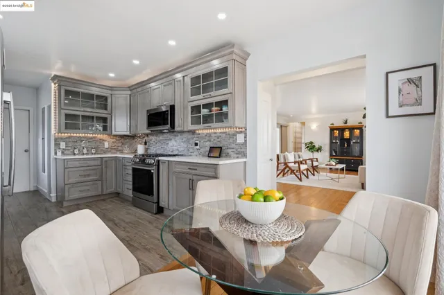 a kitchen with stainless steel appliances granite countertop a stove and a sink