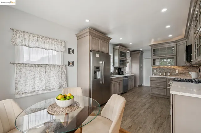 a kitchen with granite countertop a stove and a sink