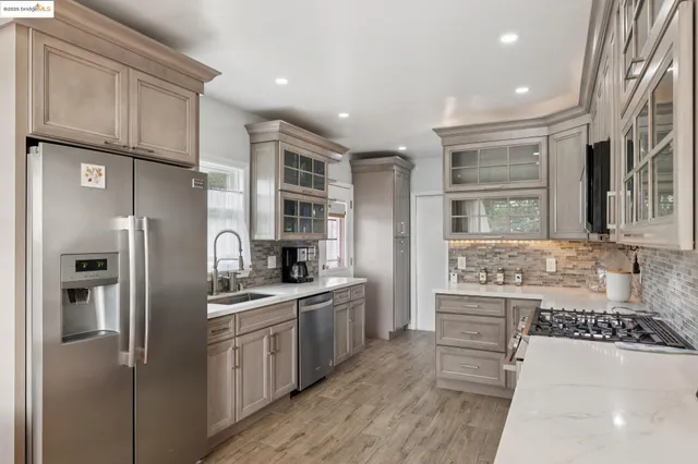 a kitchen with a sink and a refrigerator