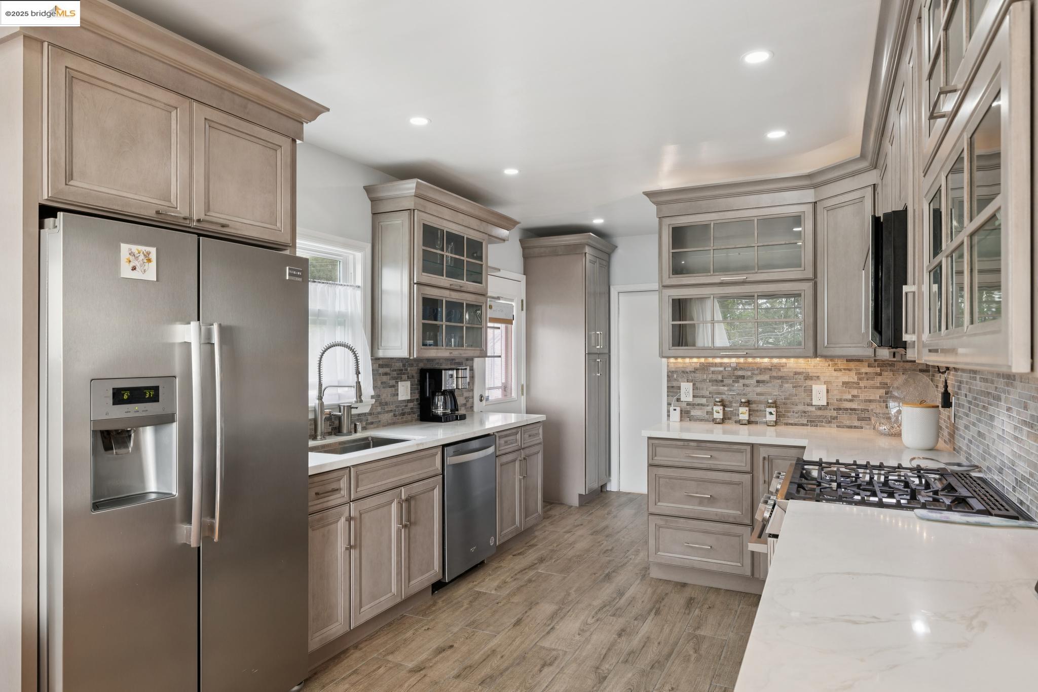 1034 Navellier Street El Cerrito, CA 94530 - Photo 17 of 57 a kitchen with stainless steel appliances a refrigerator sink and cabinets