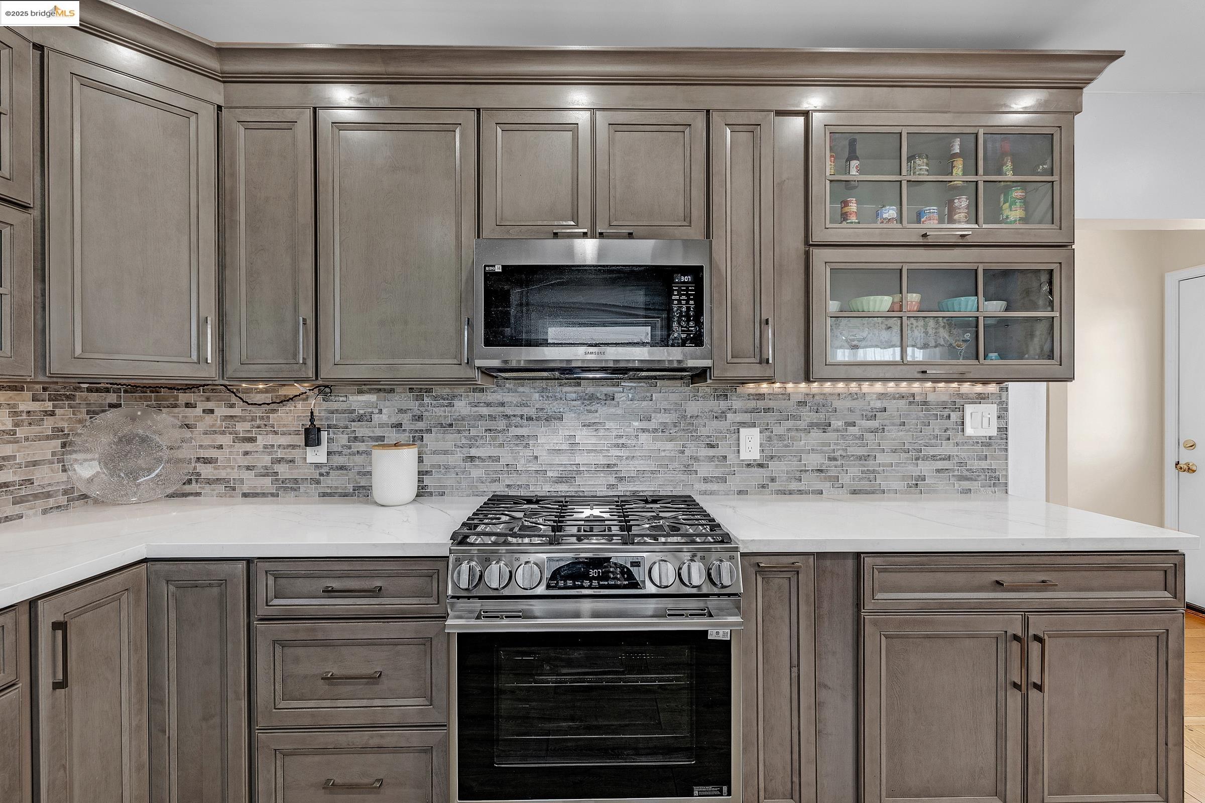 1034 Navellier Street El Cerrito, CA 94530 - Photo 20 of 57 a kitchen with granite countertop a stove and a sink