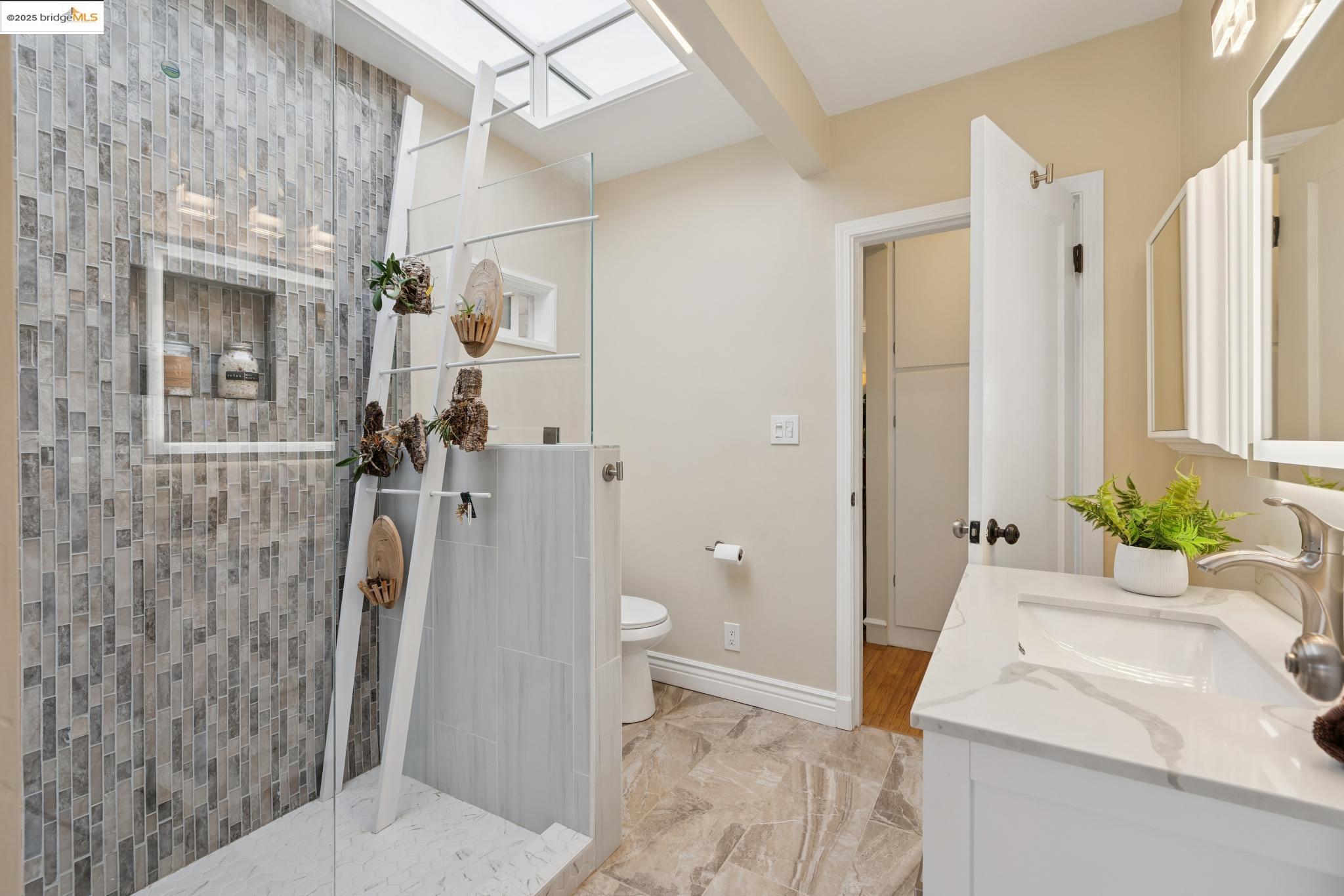 1034 Navellier Street El Cerrito, CA 94530 - Photo 25 of 57 a bathroom with a sink a toilet and shower