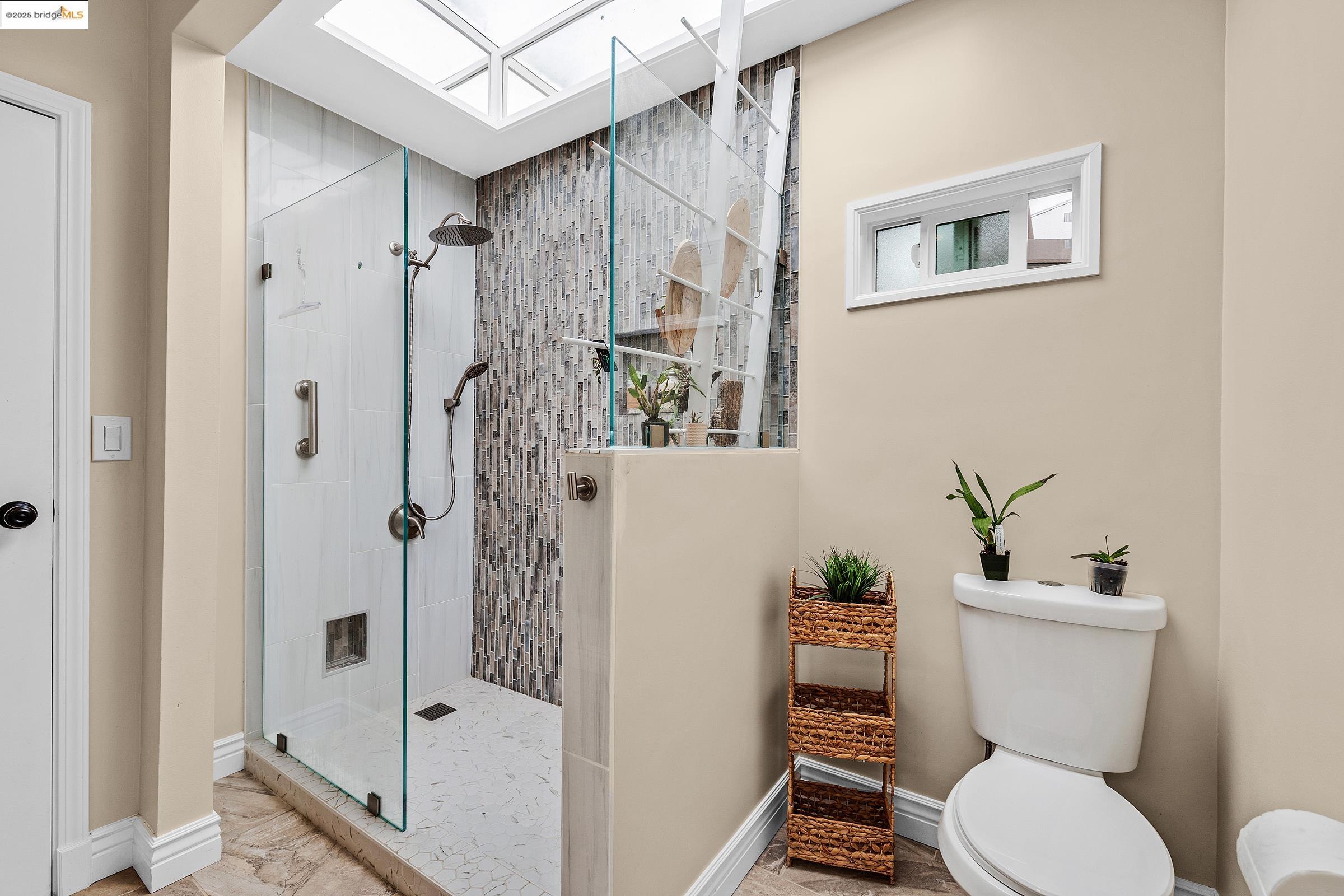 1034 Navellier Street El Cerrito, CA 94530 - Photo 26 of 57 a white toilet sitting next to a bathroom