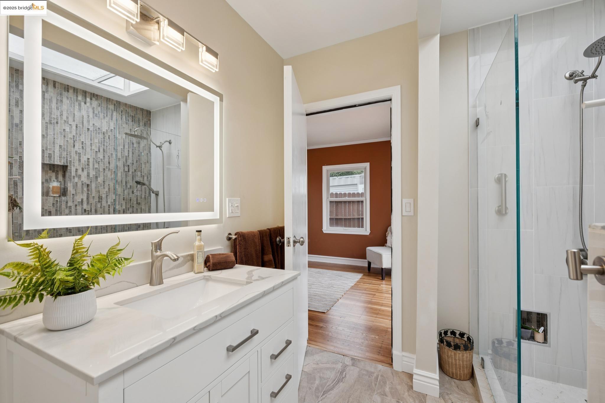 1034 Navellier Street El Cerrito, CA 94530 - Photo 28 of 57 a bathroom with a sink vanity and a mirror