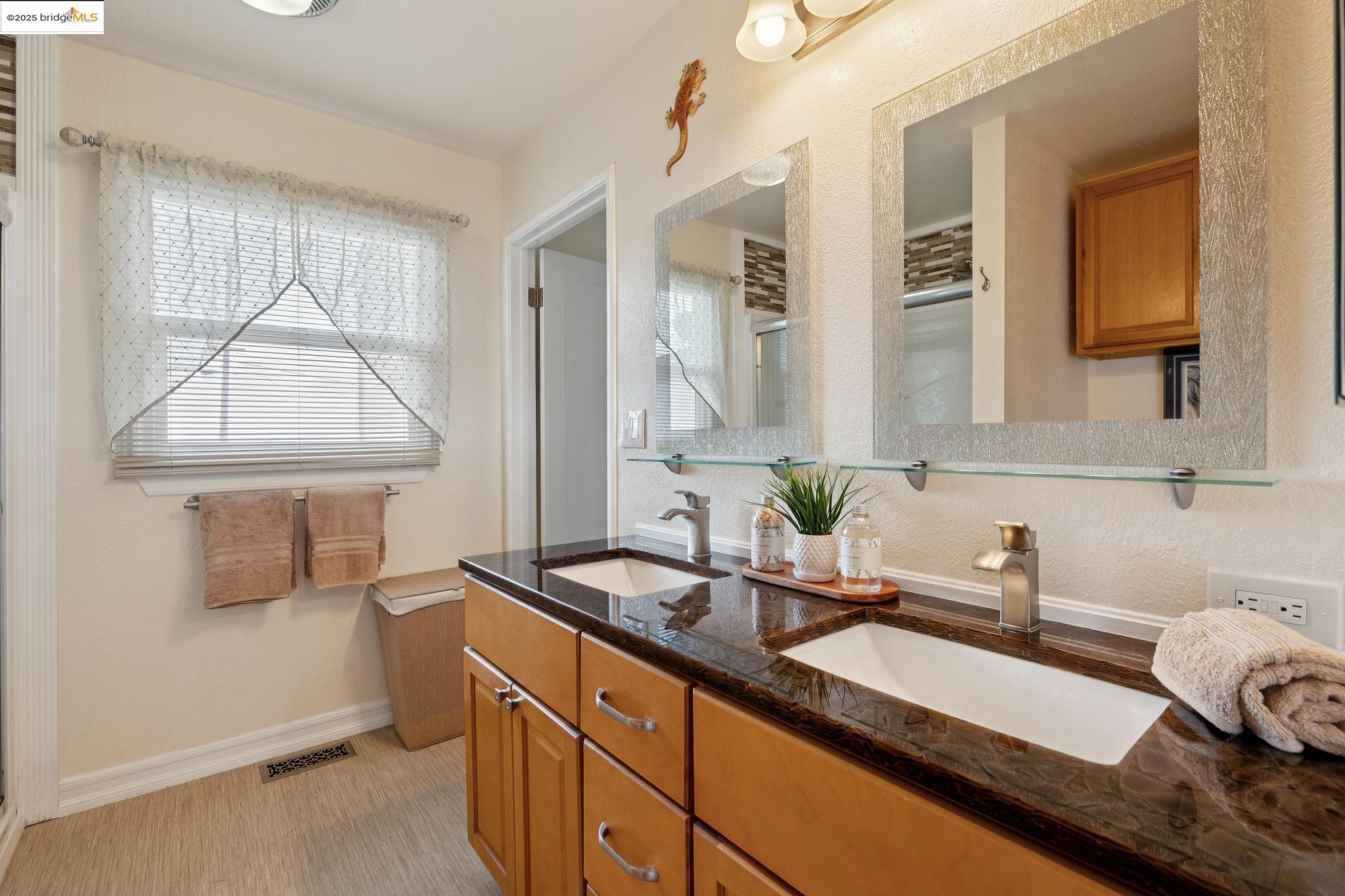1034 Navellier Street El Cerrito, CA 94530 - Photo 36 of 57 a bathroom with a sink and a mirror