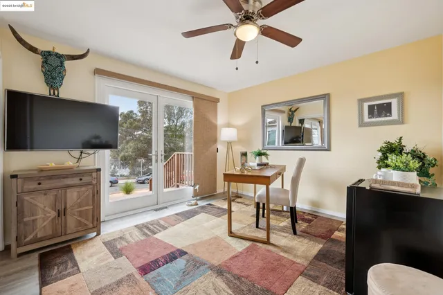 a view of a patio with table and chairs and potted plants