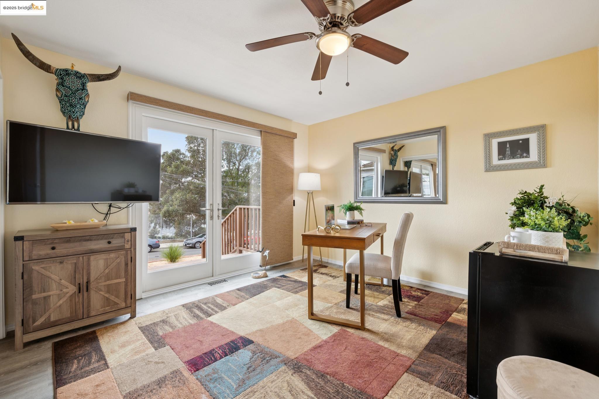1034 Navellier Street El Cerrito, CA 94530 - Photo 39 of 57 a living room with furniture and a flat screen tv
