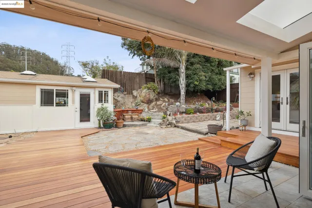 a kitchen with stainless steel appliances granite countertop a sink and a refrigerator