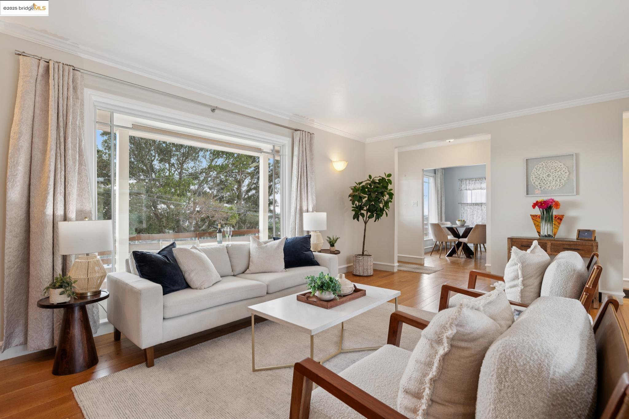 1034 Navellier Street El Cerrito, CA 94530 - Photo 9 of 57 a living room with furniture and a large window