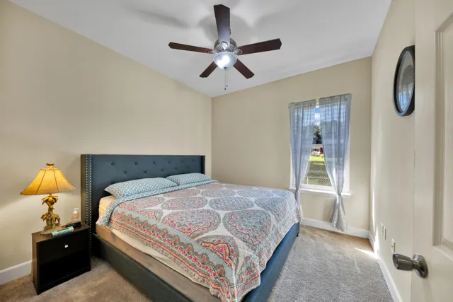 a bedroom with a bed and window