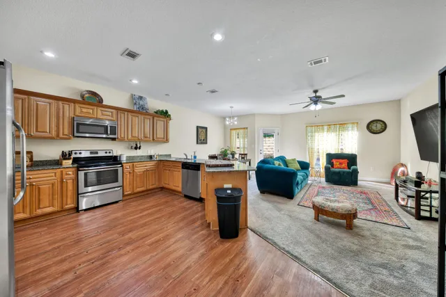 a kitchen with a refrigerator counter top space