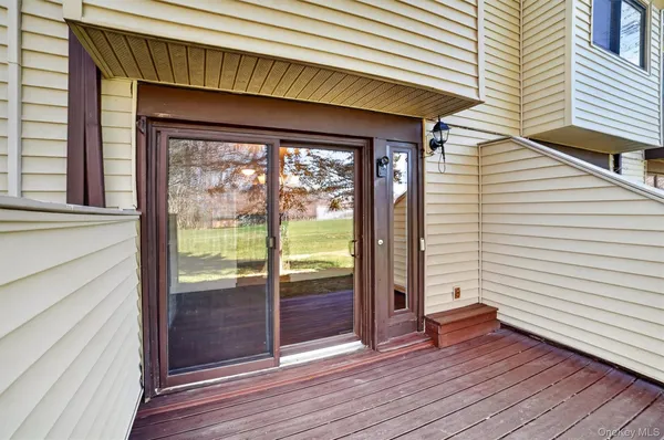 a view of front door and deck of the house