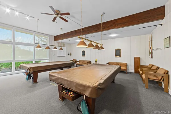a workspace with furniture window and wooden floor
