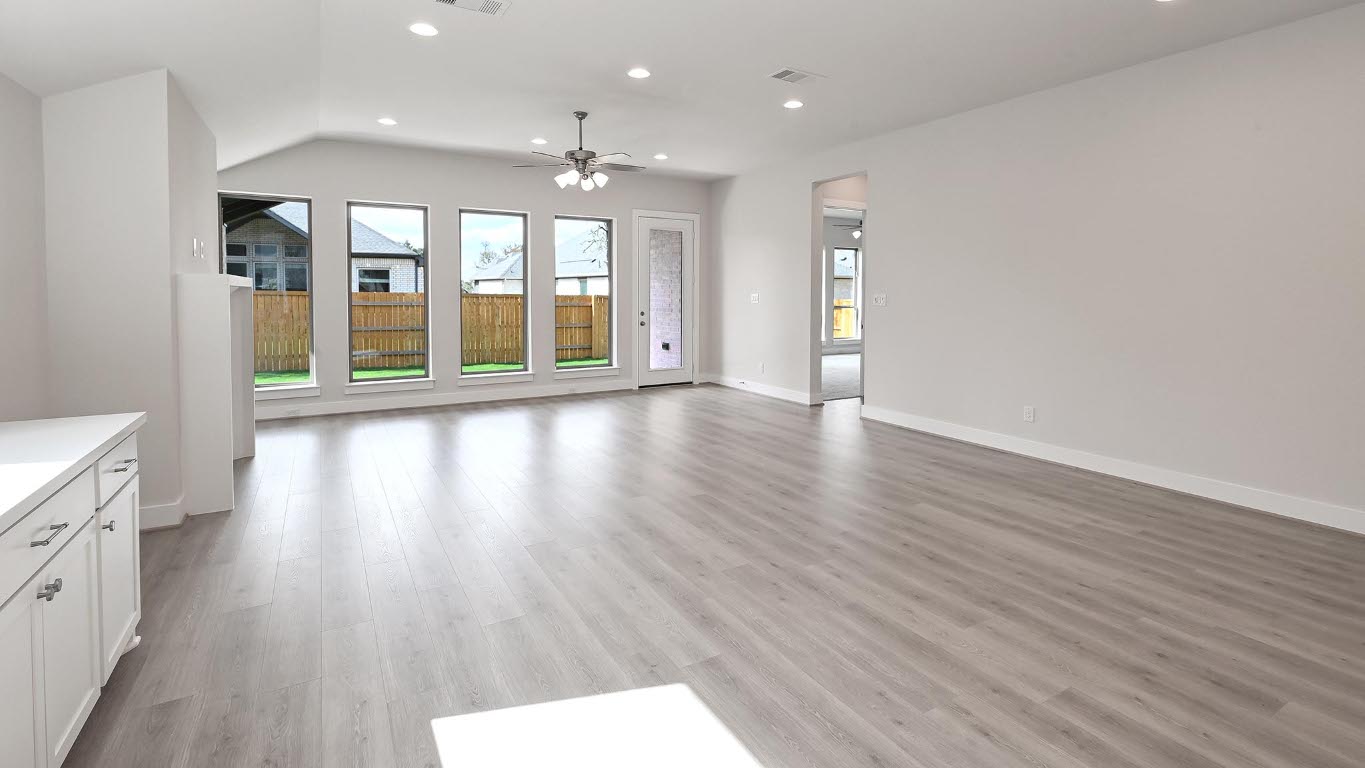 136 Brewer Street Kyle, TX 78640 - Photo 9 of 40 Unfurnished living room with recessed lighting, light wood-type flooring, and ceiling fan