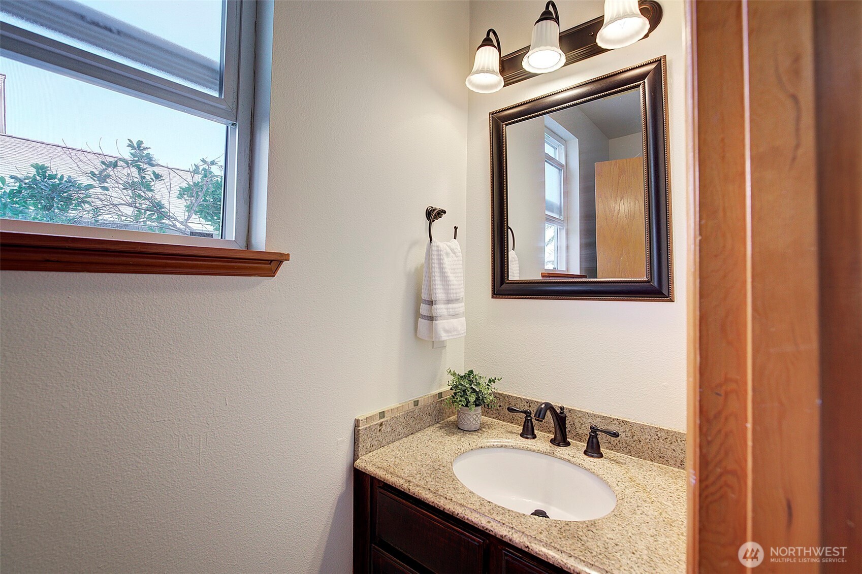 3002 200th Street Southeast Bothell, WA 98012 - Photo 13 of 34 a bathroom with a granite countertop sink and a mirror