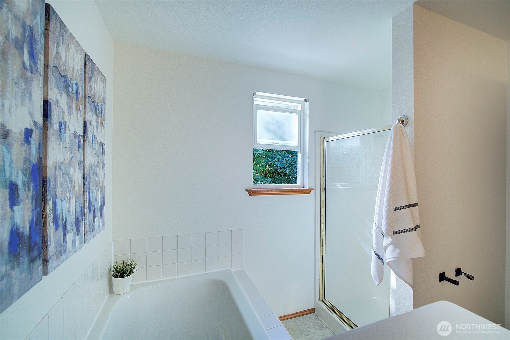 3002 200th Street Southeast Bothell, WA 98012 - Photo 21 of 34 a bathroom with a bathtub and a shower