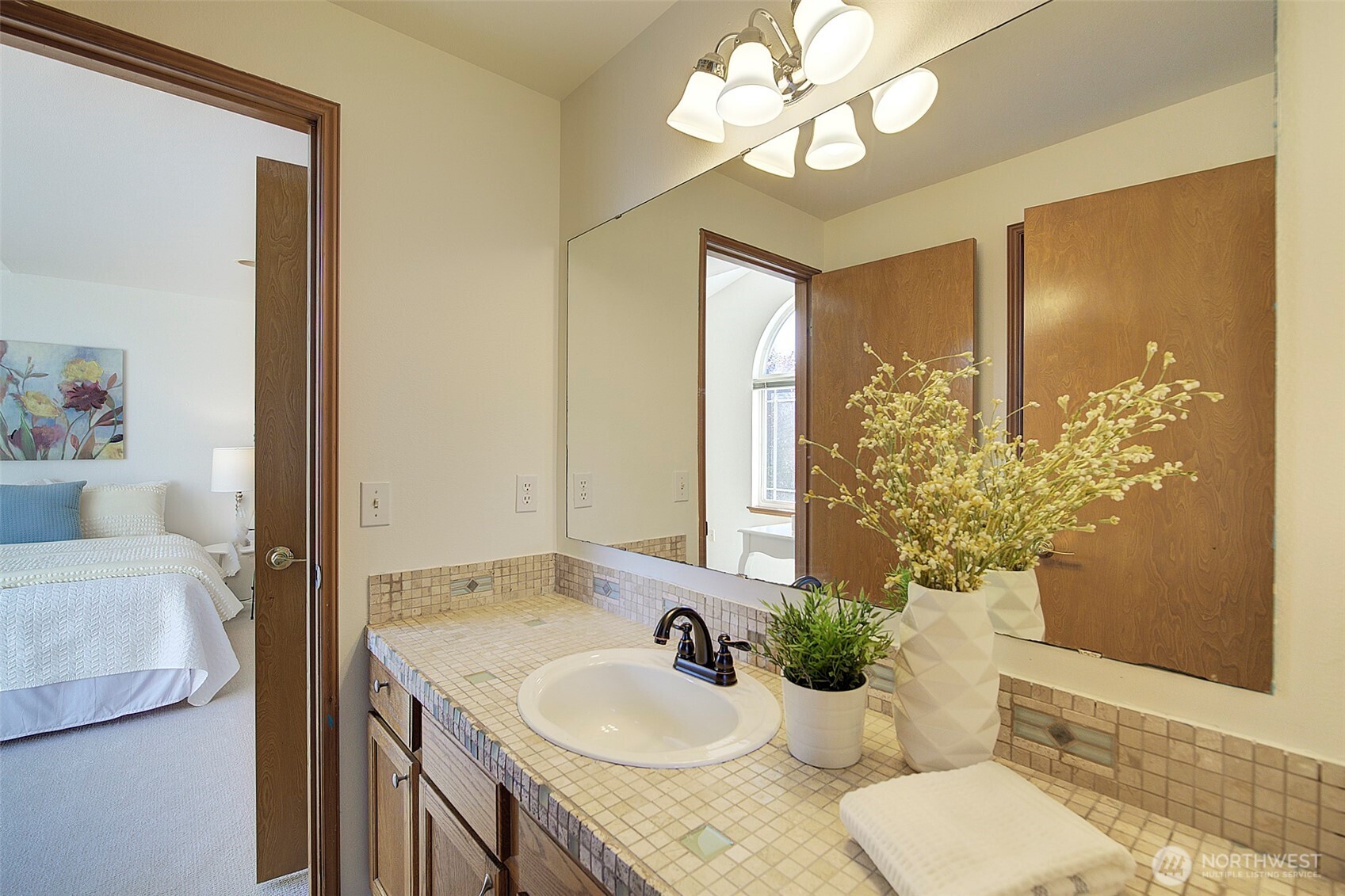3002 200th Street Southeast Bothell, WA 98012 - Photo 25 of 34 a bathroom with a granite countertop sink and a mirror