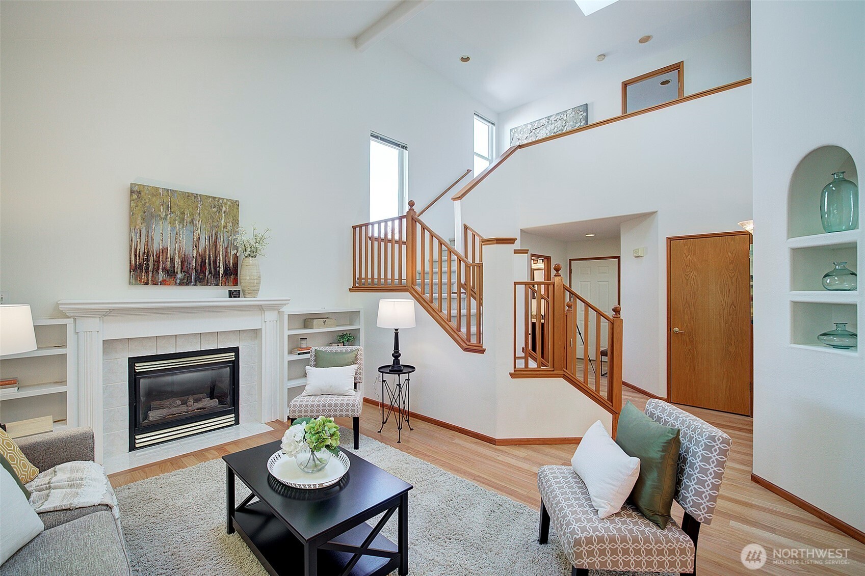 3002 200th Street Southeast Bothell, WA 98012 - Photo 4 of 34 a living room with furniture a fireplace and a table