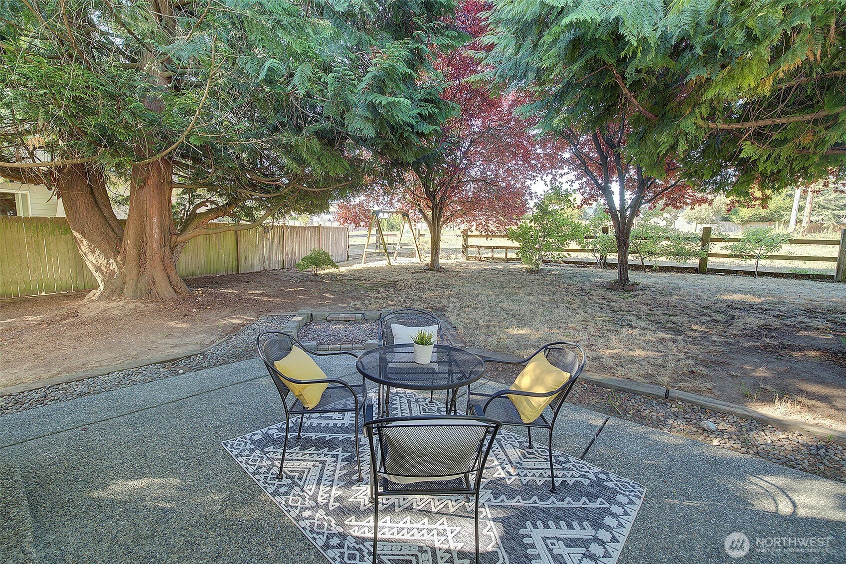 3002 200th Street Southeast Bothell, WA 98012 - Photo 9 of 34 a backyard of a house with table and chairs