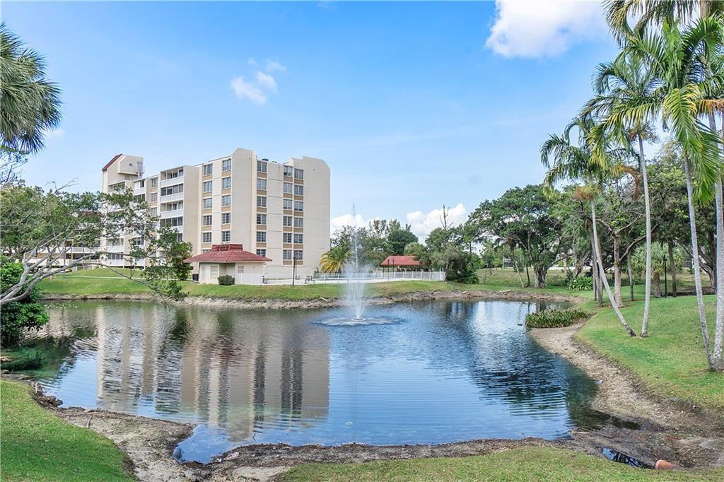 7081 Environ Boulevard, Unit 242 Lauderhill, FL 33319 - Photo 2 of 4 a view of a water with a building in the background