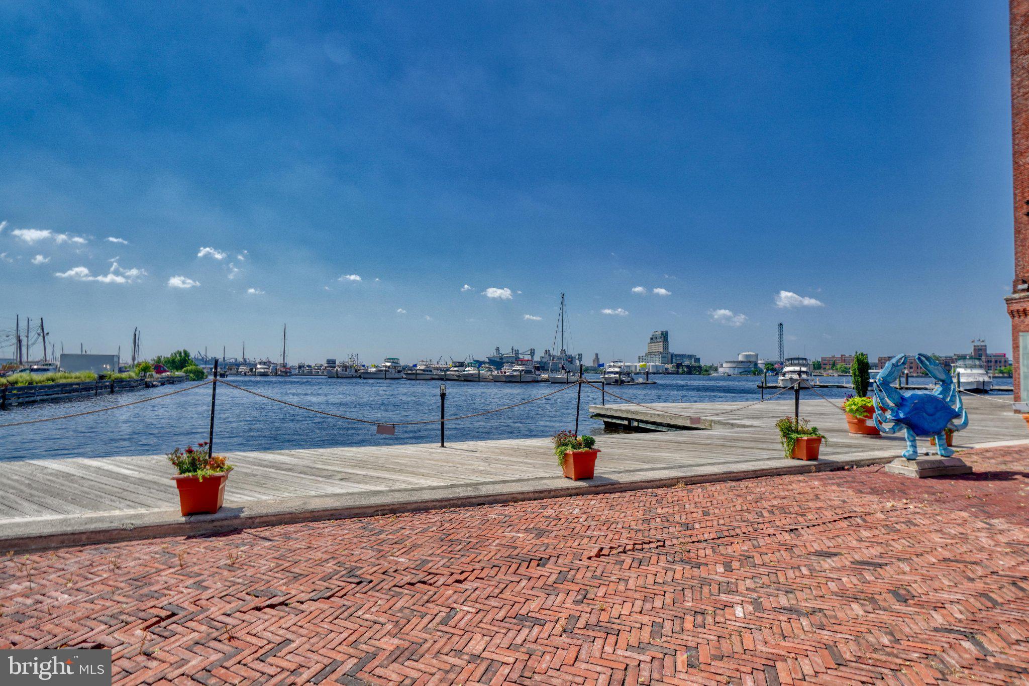 1000 Fell Street, Unit 606 Baltimore, MD 21231 - Photo 52 of 56 Scenic waterfront with vibrant skies.