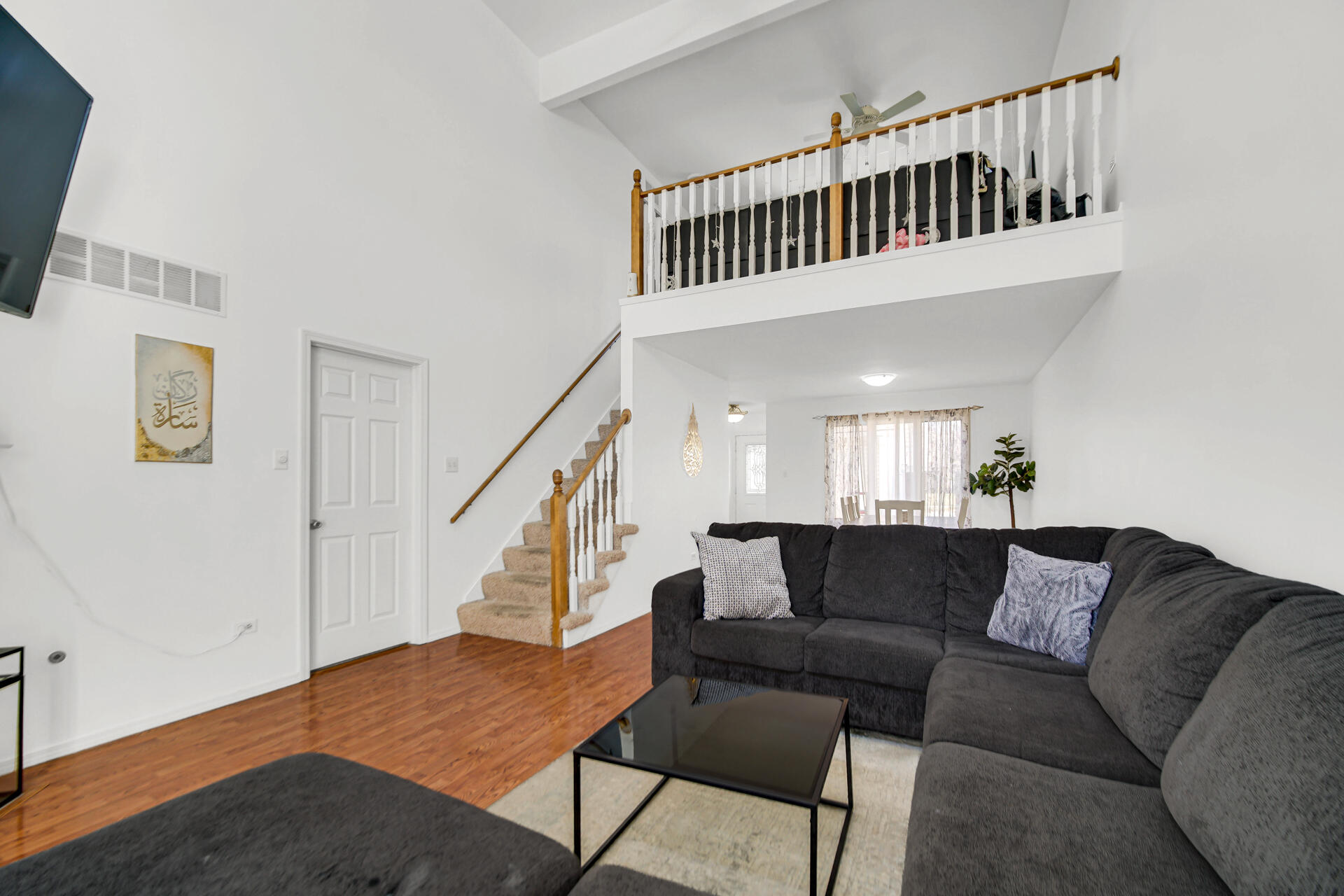 9993 Hunters Run St. John, IN 46373 - Photo 11 of 28 a living room with furniture and stairs