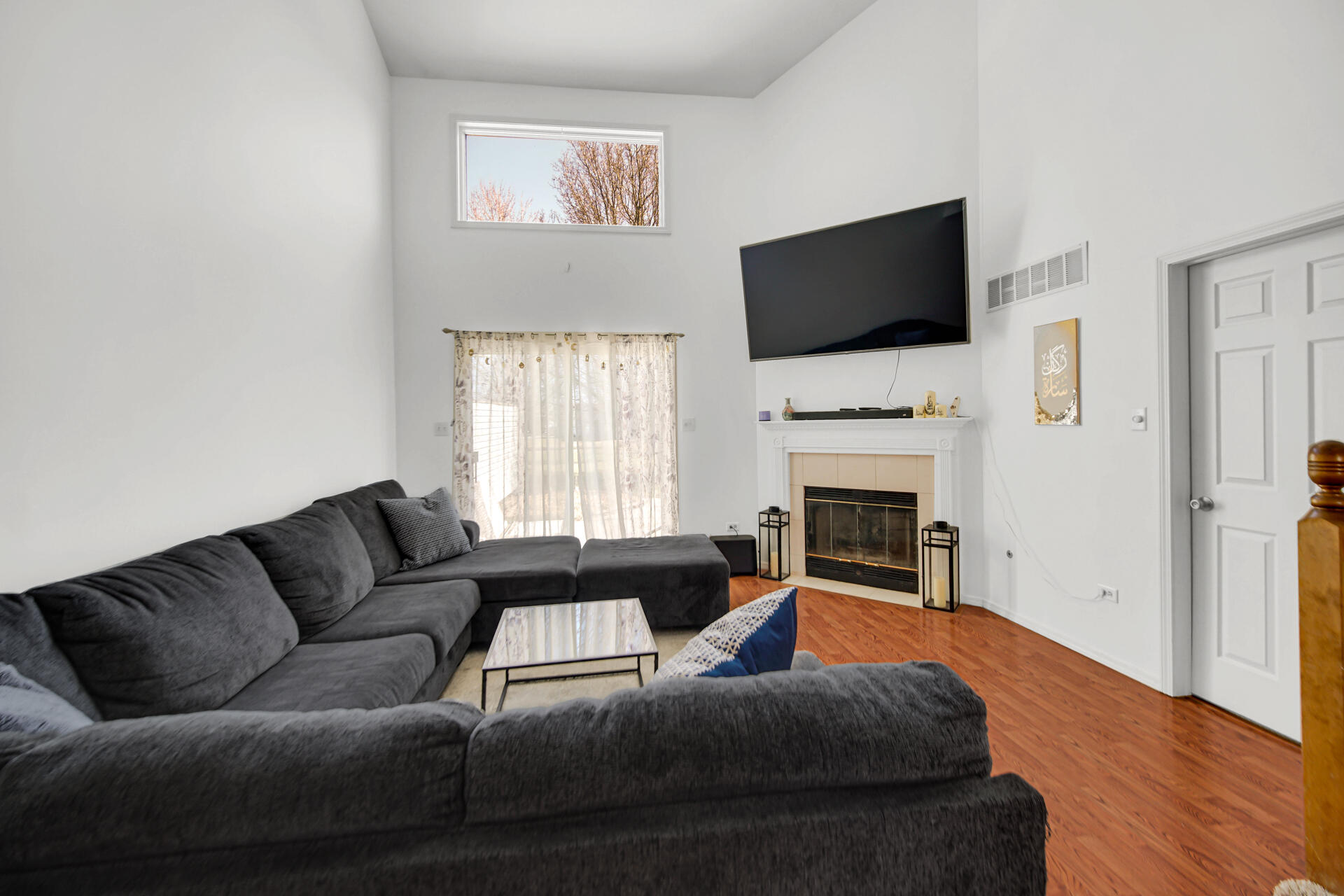 9993 Hunters Run St. John, IN 46373 - Photo 12 of 28 a living room with furniture fireplace and flat screen tv
