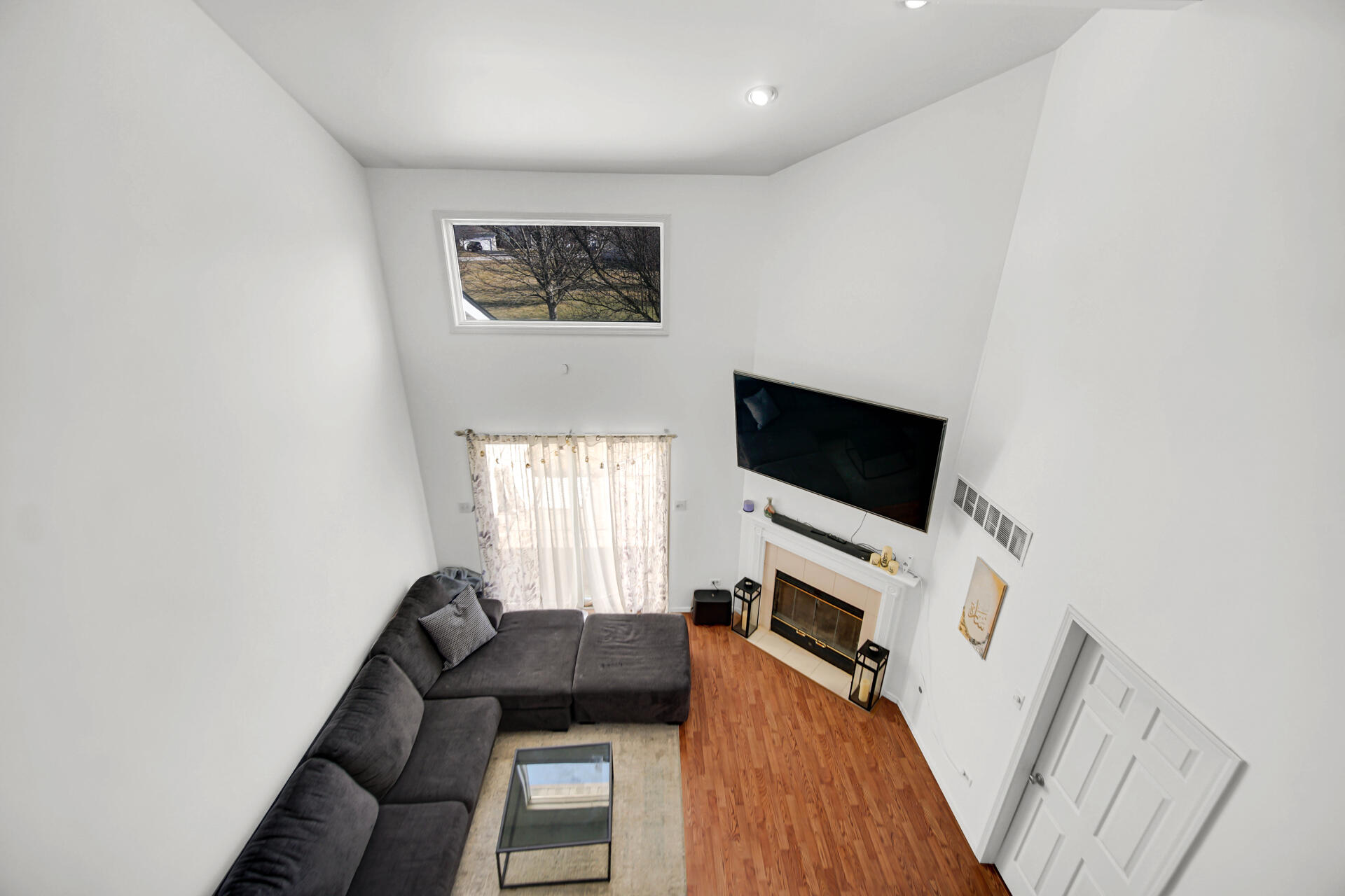9993 Hunters Run St. John, IN 46373 - Photo 13 of 28 a living room with furniture and a flat screen tv