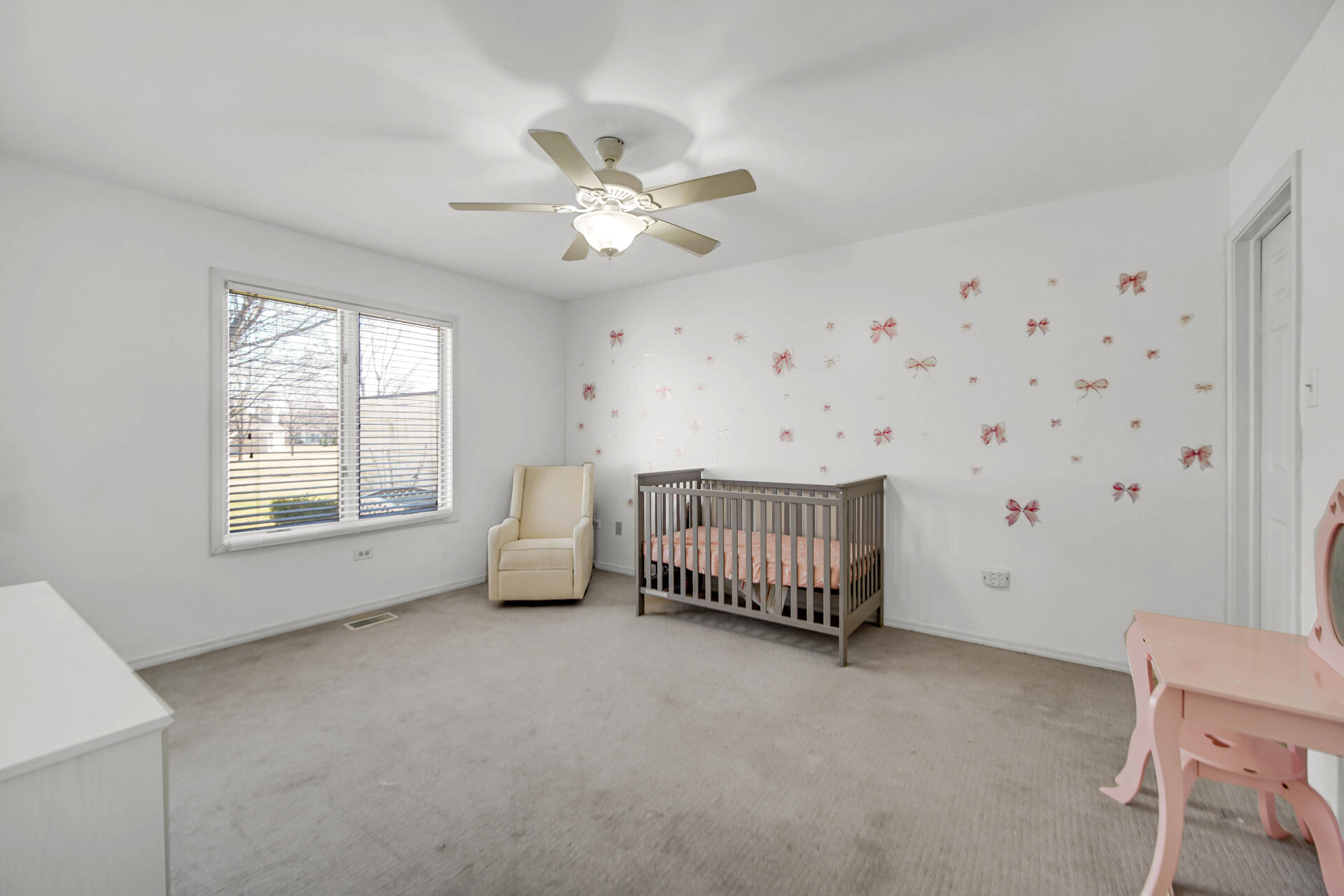 9993 Hunters Run St. John, IN 46373 - Photo 19 of 28 a view of a livingroom with a ceiling fan and window