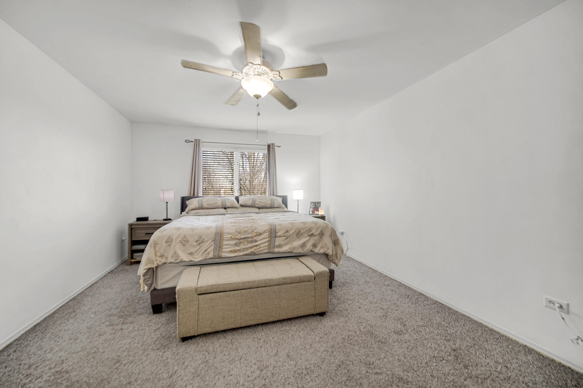9993 Hunters Run St. John, IN 46373 - Photo 20 of 28 a bedroom with a bed and a chandelier