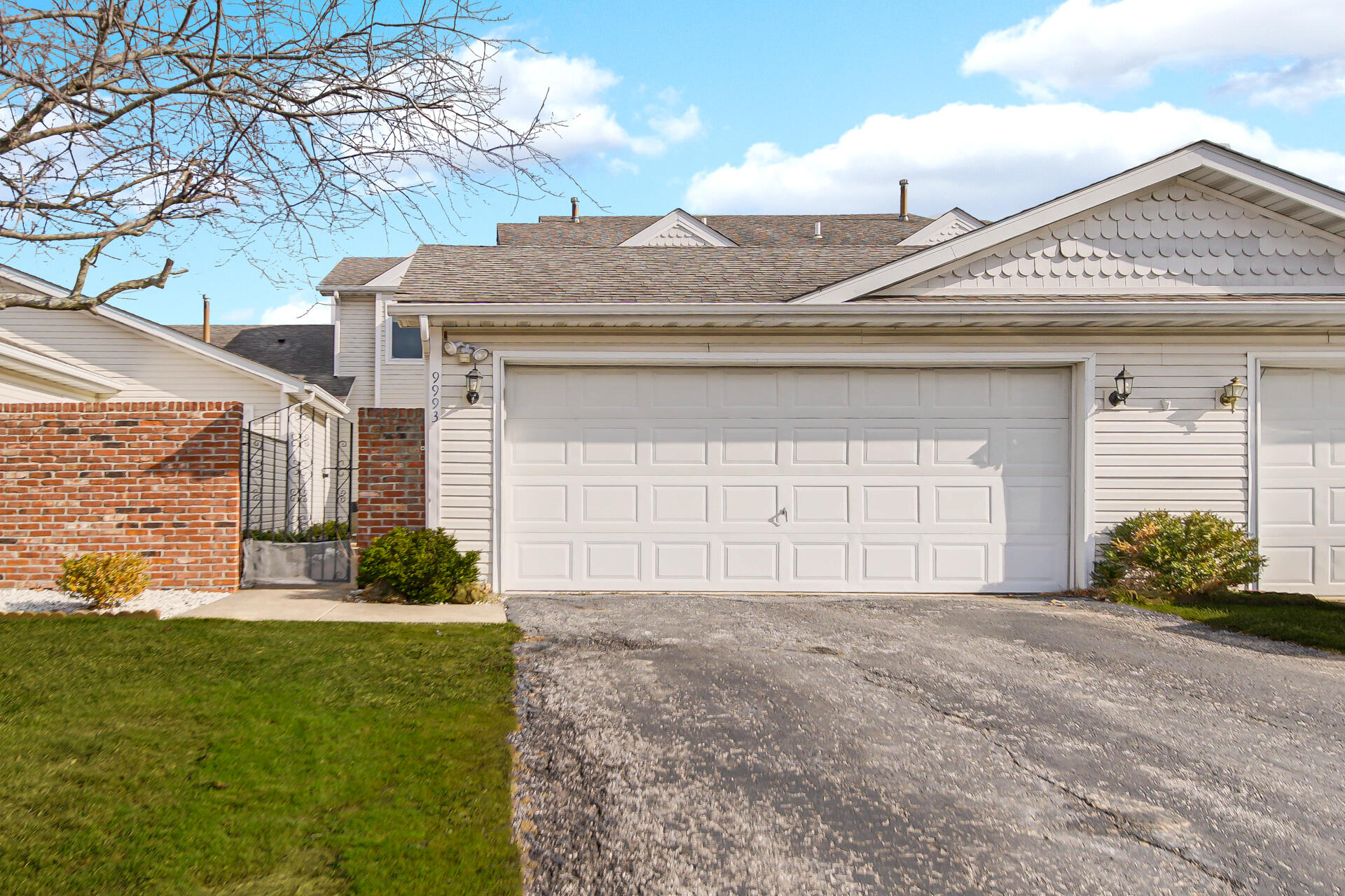 9993 Hunters Run St. John, IN 46373 - Photo 2 of 28 a front view of a house with garden